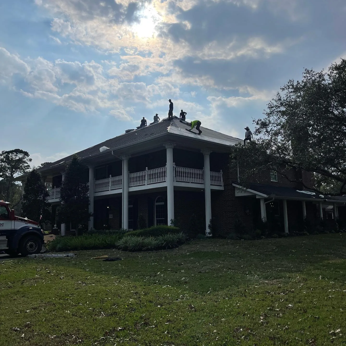 TAC crew completing a roof replacement on a large Baytown home